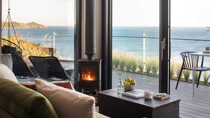 Admire the mesmerising sea views from the comfort of the gorgeous green sofa....