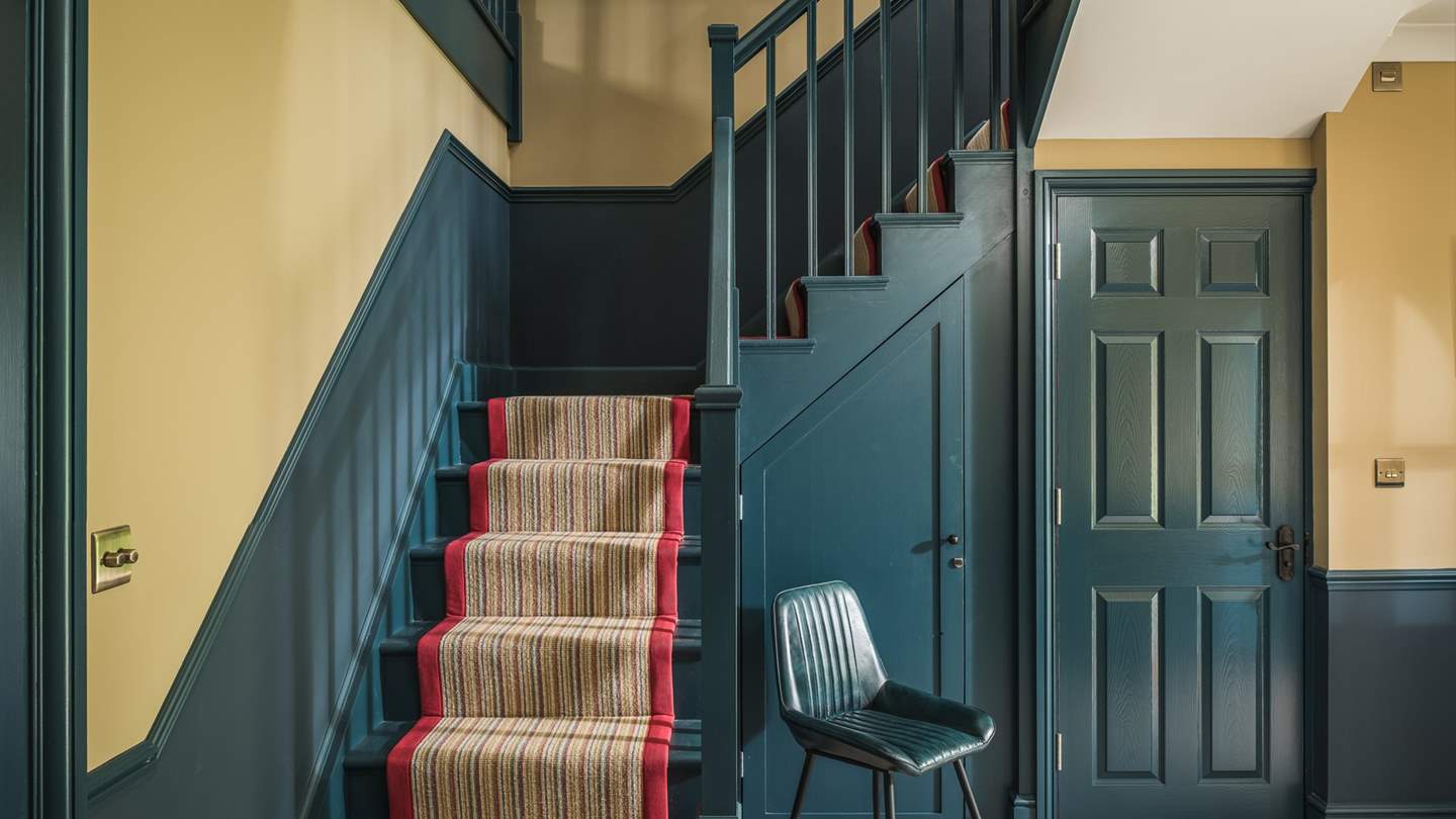 Head up the stairs to find three equally beautiful bedrooms...