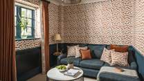 The snug is the perfect spot for younger ones, with a comfy corner sofa and a smart television 