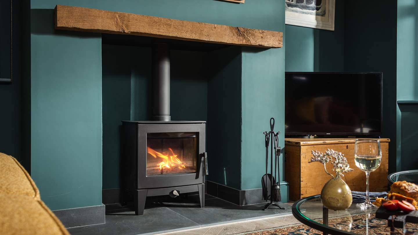 Keep toasty and warm by the flickering wood burner 