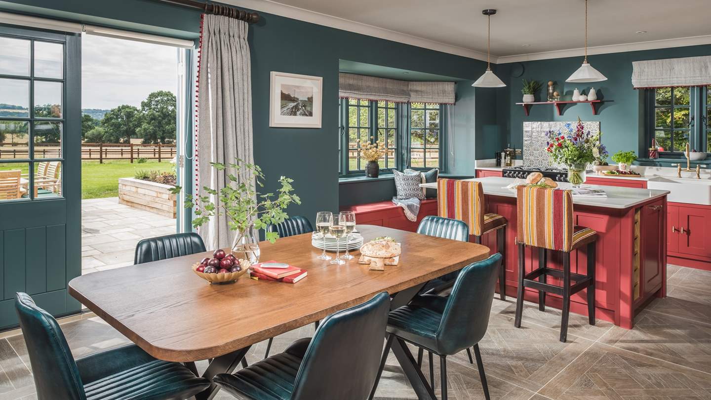 The open plan kitchen and dining space is perfectly positioned to make the most of the far reaching views across the picturesque surroundings 