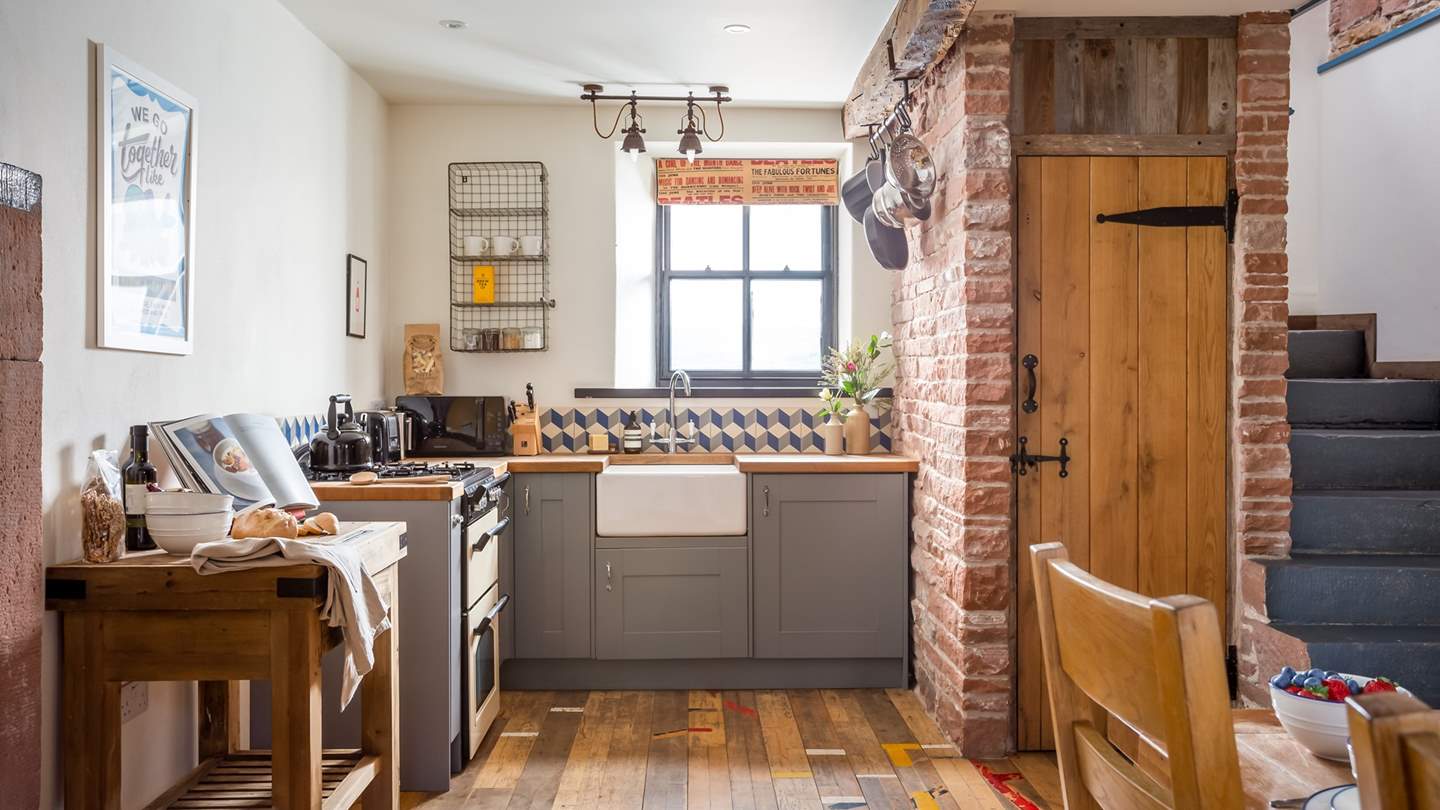 Whip up culinary delights in the charming kitchen 