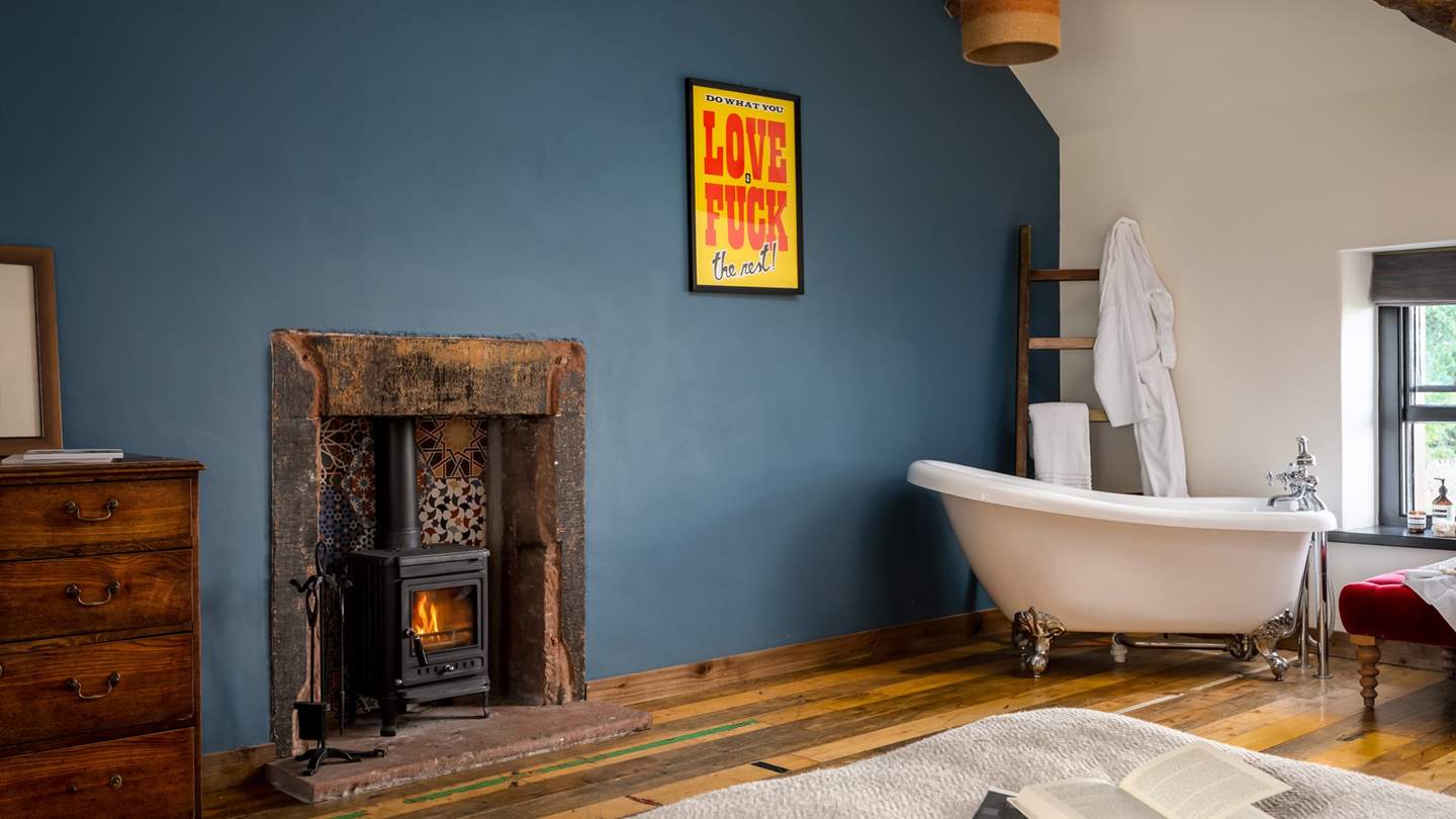 The wood burning stove is a lovely addition to the master bedroom, perfect for creating cosy settings 