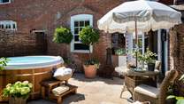 Step outside into a beautiful suntrap, complete with a table and chairs for alfresco meals à deux