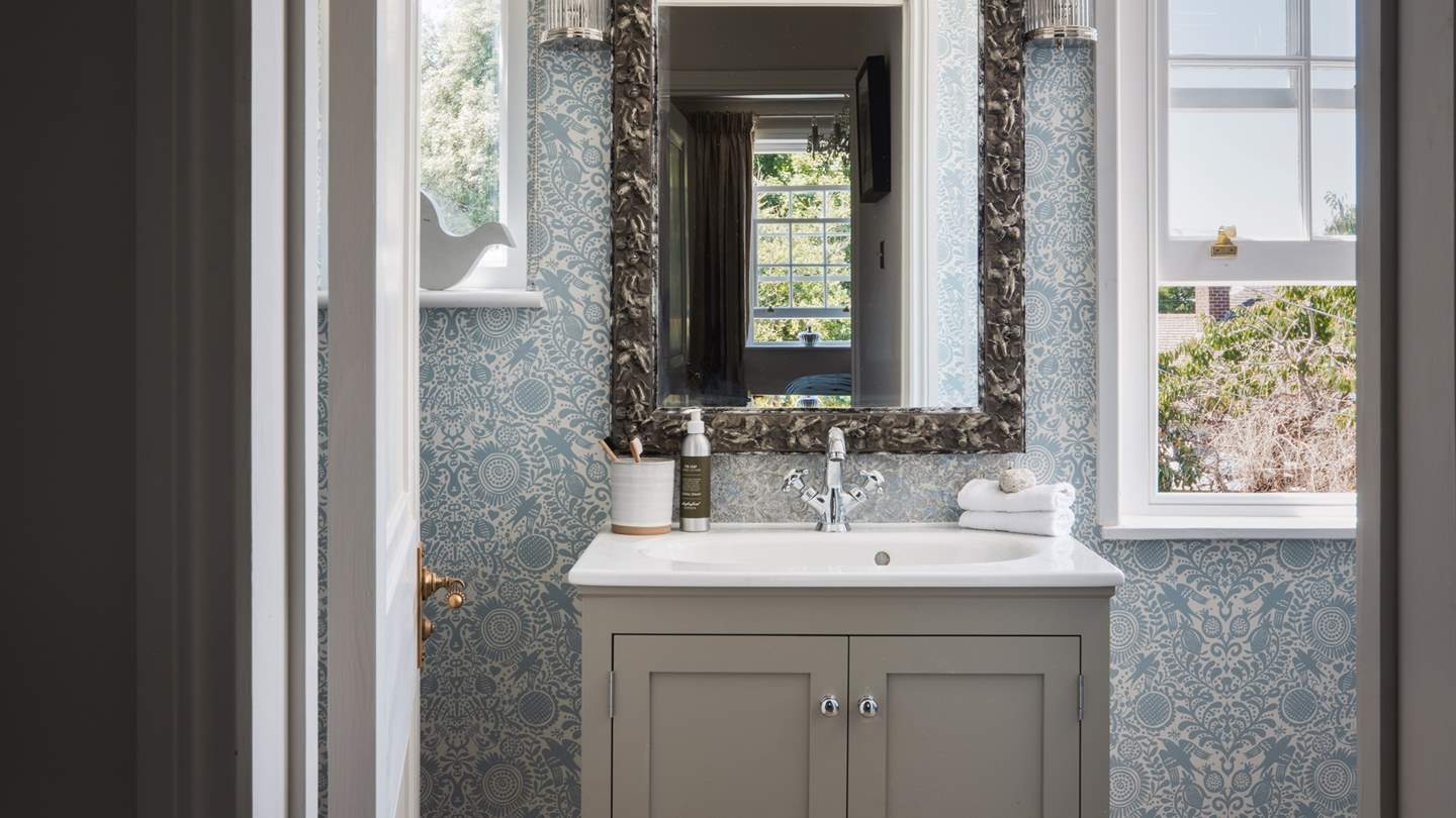 The en suite is pretty as a picture, with a free standing bath and a separate shower 