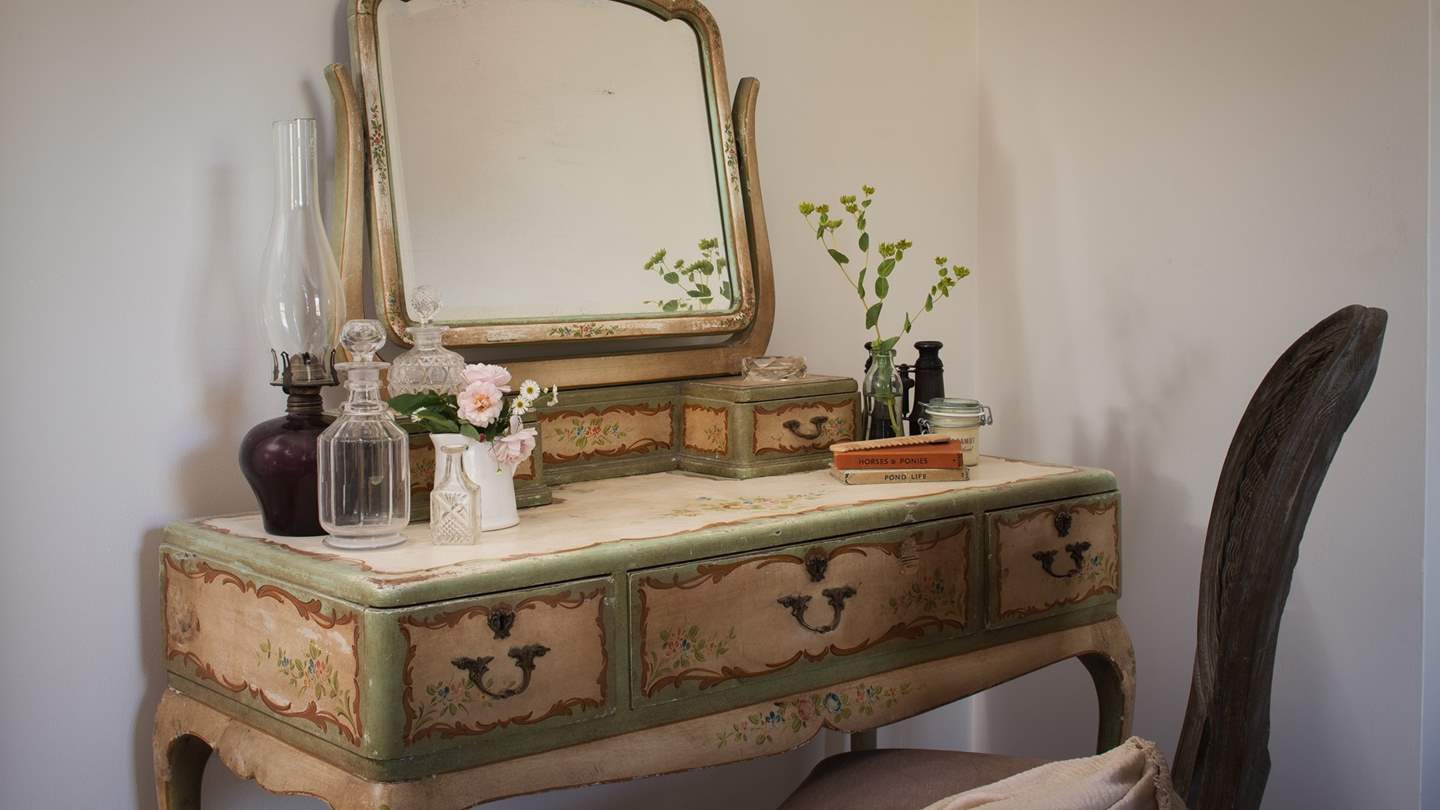 The bedroom also has a beautiful antique dressing table 