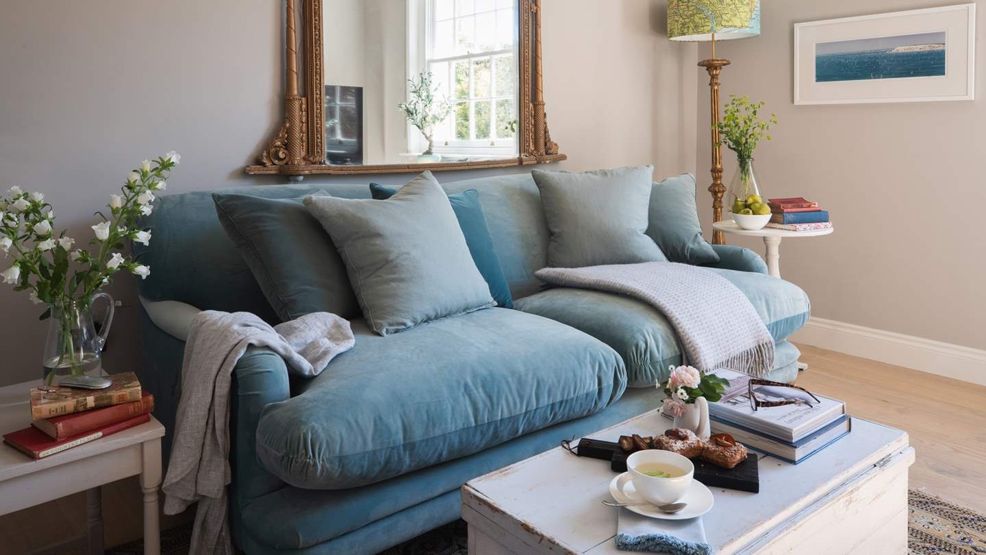 Nestle up on the snug blue sofa, with a smart TV to keep you entertained 