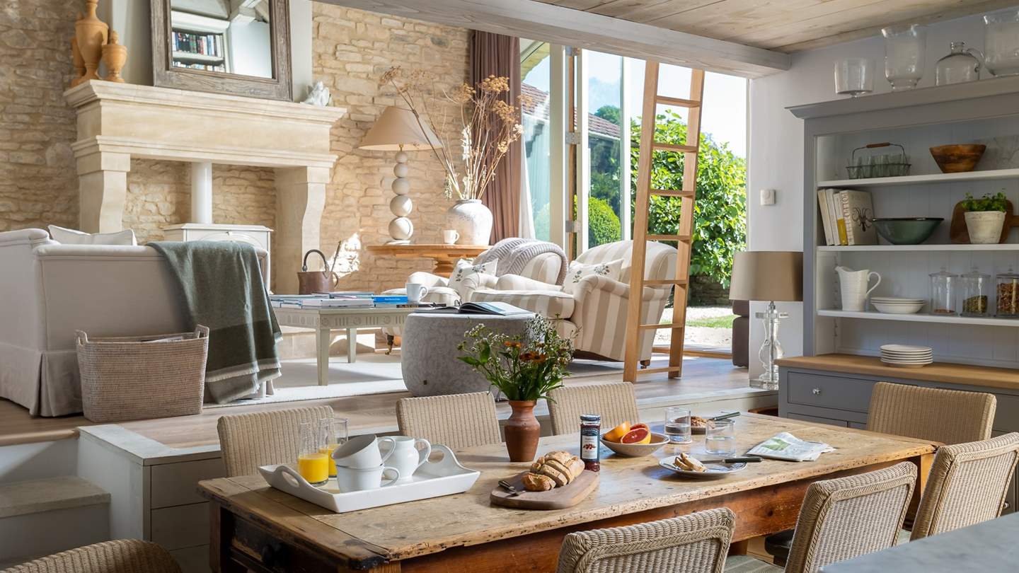 One of two dining tables, this characterful wooden table is perfect for informal meals 