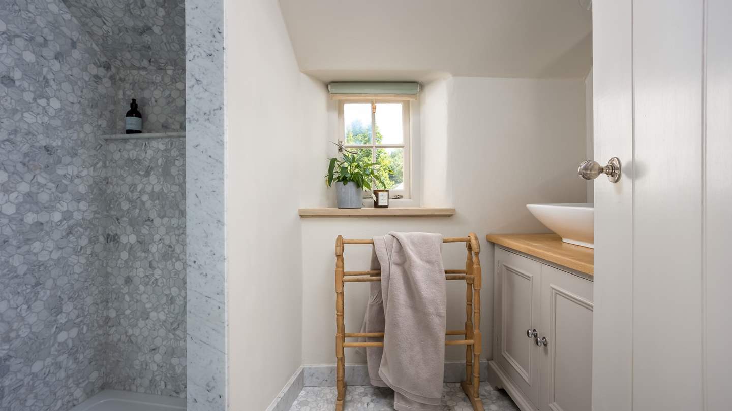 With a large walk-in shower for rejuvenating showers