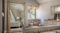We love the floral designed bed and large mirror 
