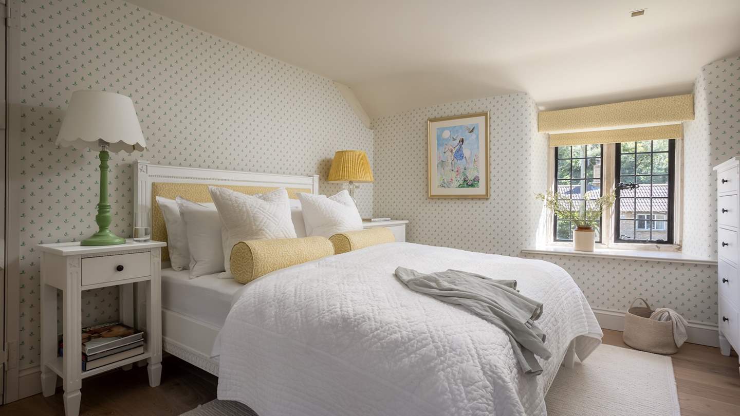 We love the subtle hints of yellow and green in the fourth bedroom