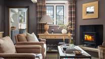 Seek moments of quietude in the inviting snug with a wood burner and drinks cabinet for post dinner drinks 