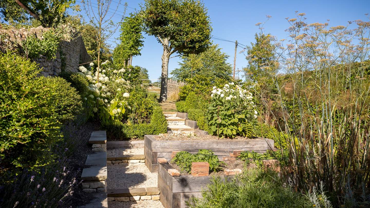 Enjoy the waves of stunning flowers and greenery as you meander through the gardens 