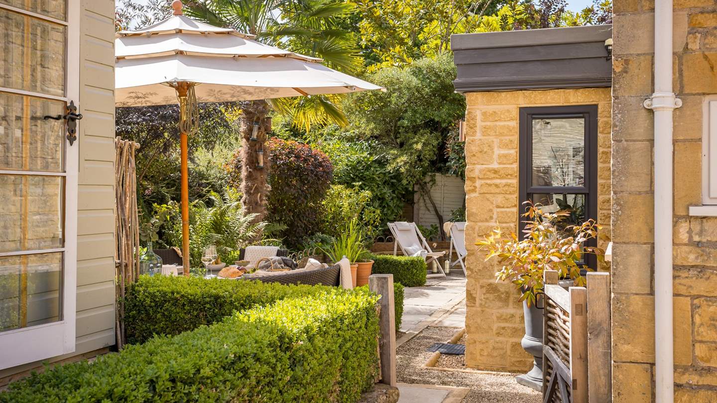 You'll never want to leave this sun-soaked garden space... 