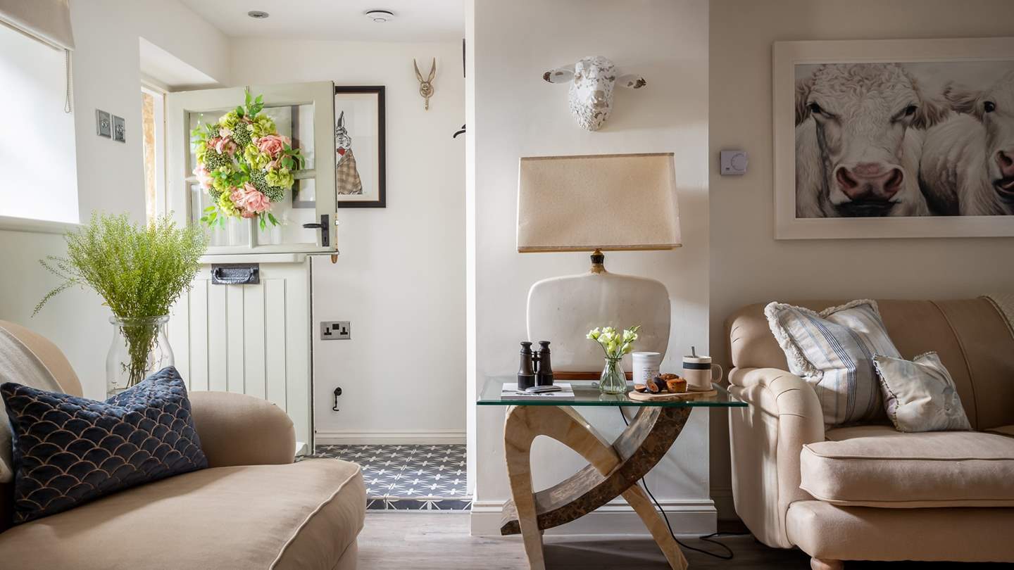 Step through the charming Dutch front door, where you'll uncover a stunning living space made for lounging together