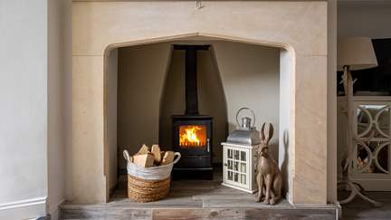 Settle beside the flickering wood burning stove on chilly days...