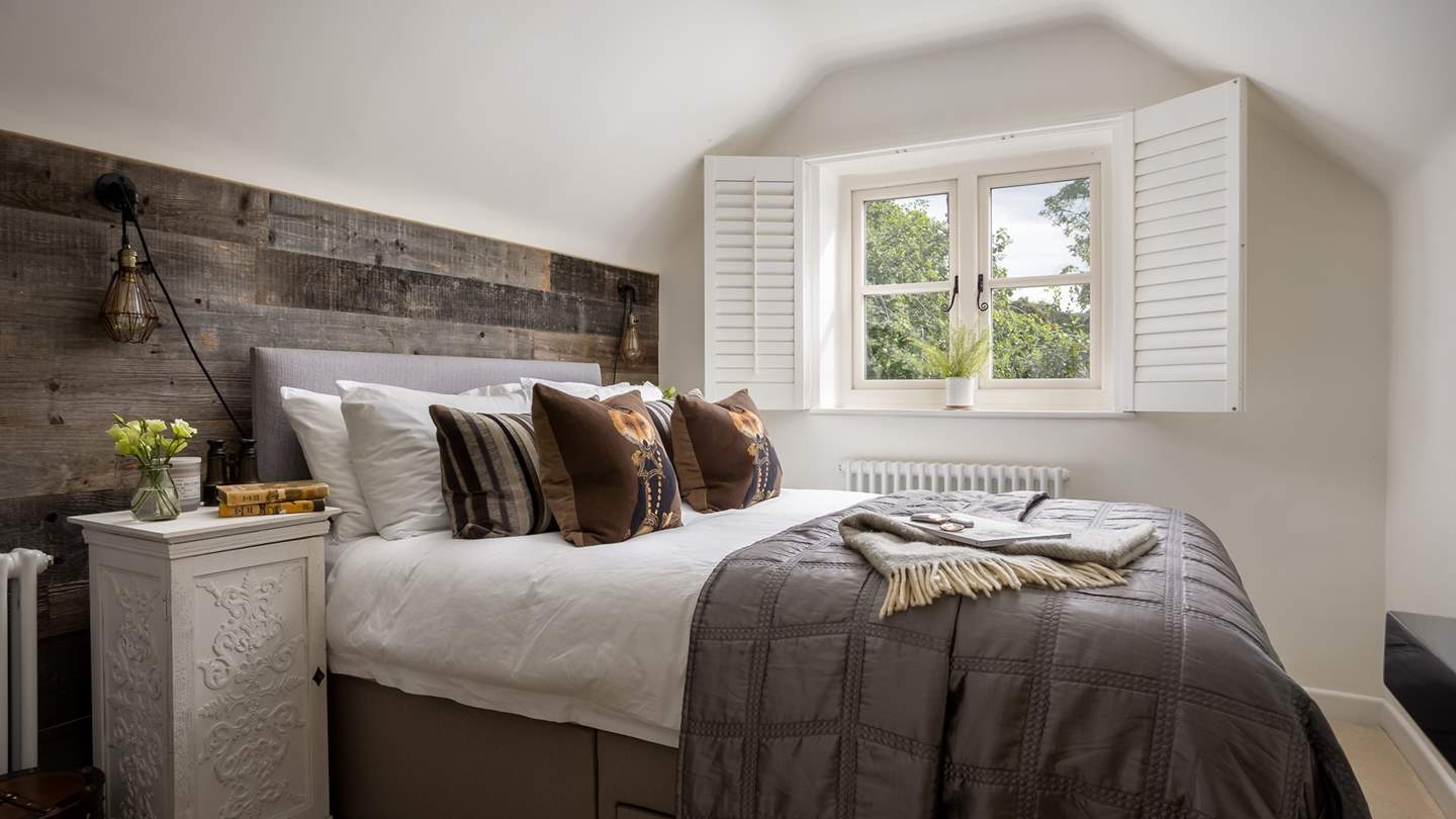 The rich chocolate tones throughout the second bedroom make for a soothing space to unwind...