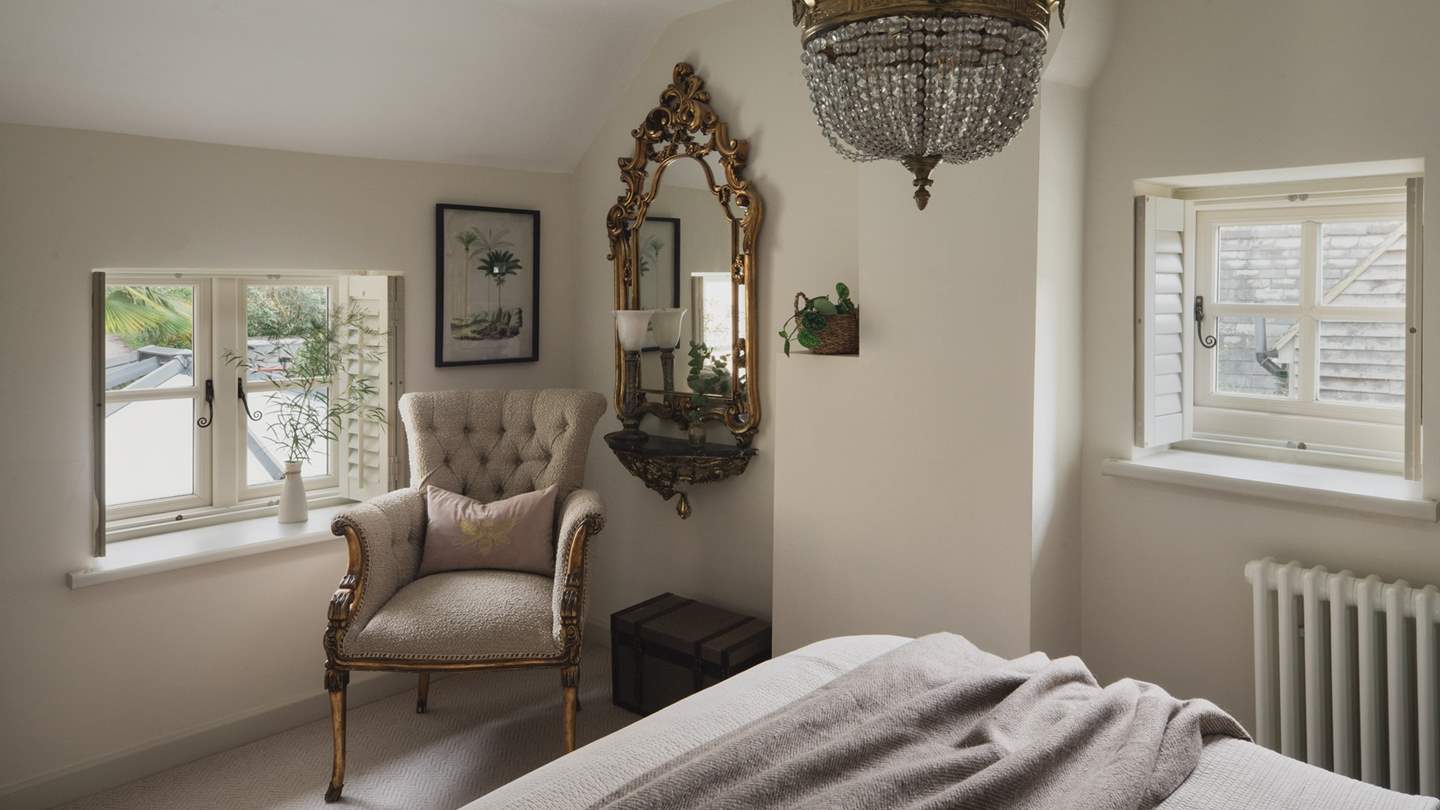 With gold detailing throughout, this boudoir is complete with a king-sized bed and an occasional armchair in a cosy boucle fabric