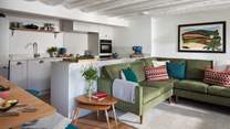 Uncover the luxurious open-plan kitchen and dining area, complete with another laid-back living space