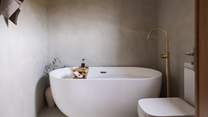 Savour bubble-topped soaks in the opulent freestanding bath