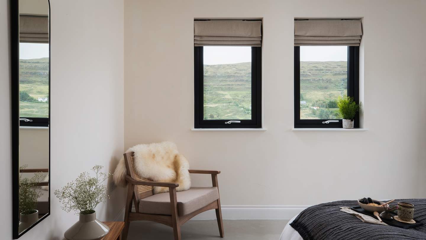 We just adore the gorgeous sheepskin-draped mocha armchair