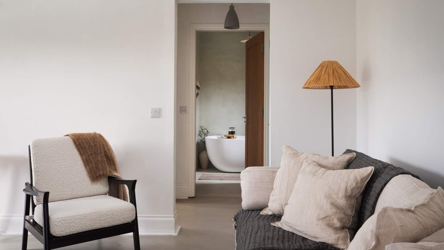 Settle on the lovely cream armchair for an afternoon snooze... 