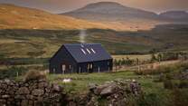 Introducing Black Box Cabin, our enchanting hideaway nestled in the Scottish wilderness