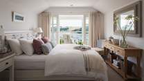 The master bedroom boasts a beautiful balcony offering the most tranquil views over St Mawes