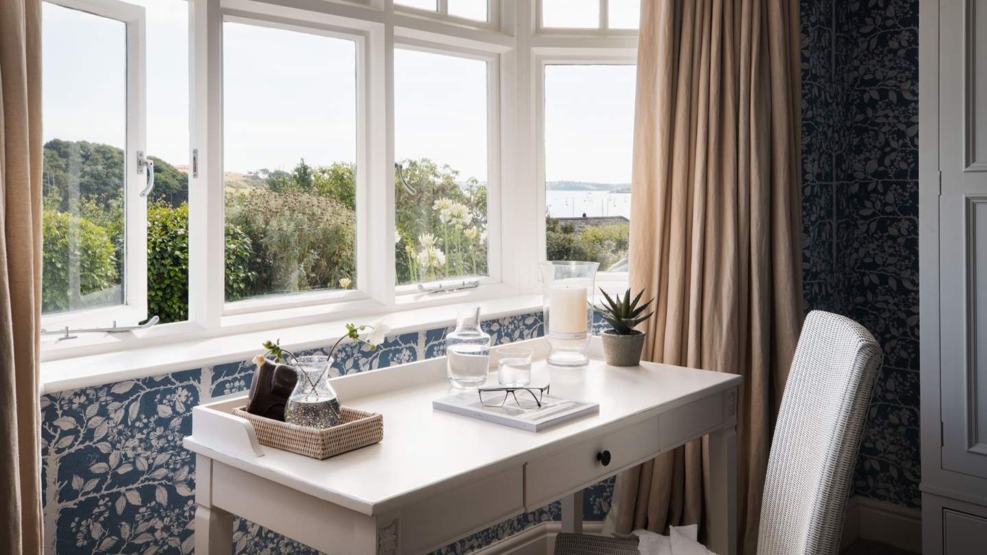 The delightful writing desk is perfectly positioned to draw inspiration from the sublime sea views 