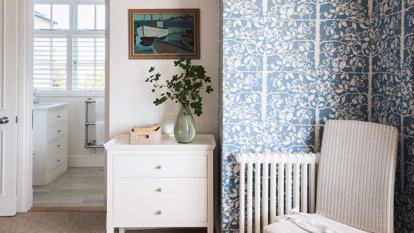 We just adore the bold floral print throughout this bedroom