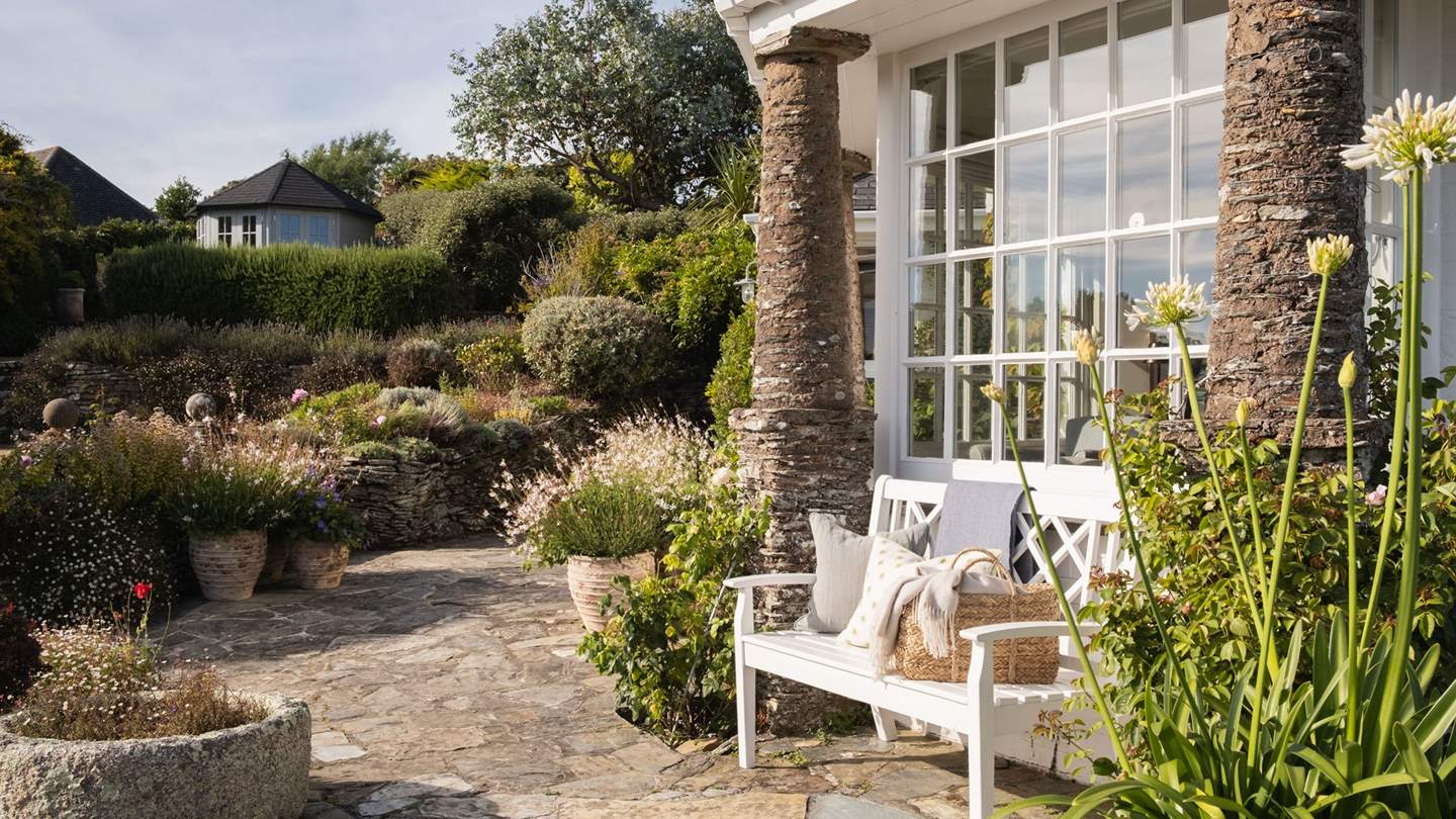 You'll find lovely white benches amongst the flowers throughout Polvarth's gardens 
