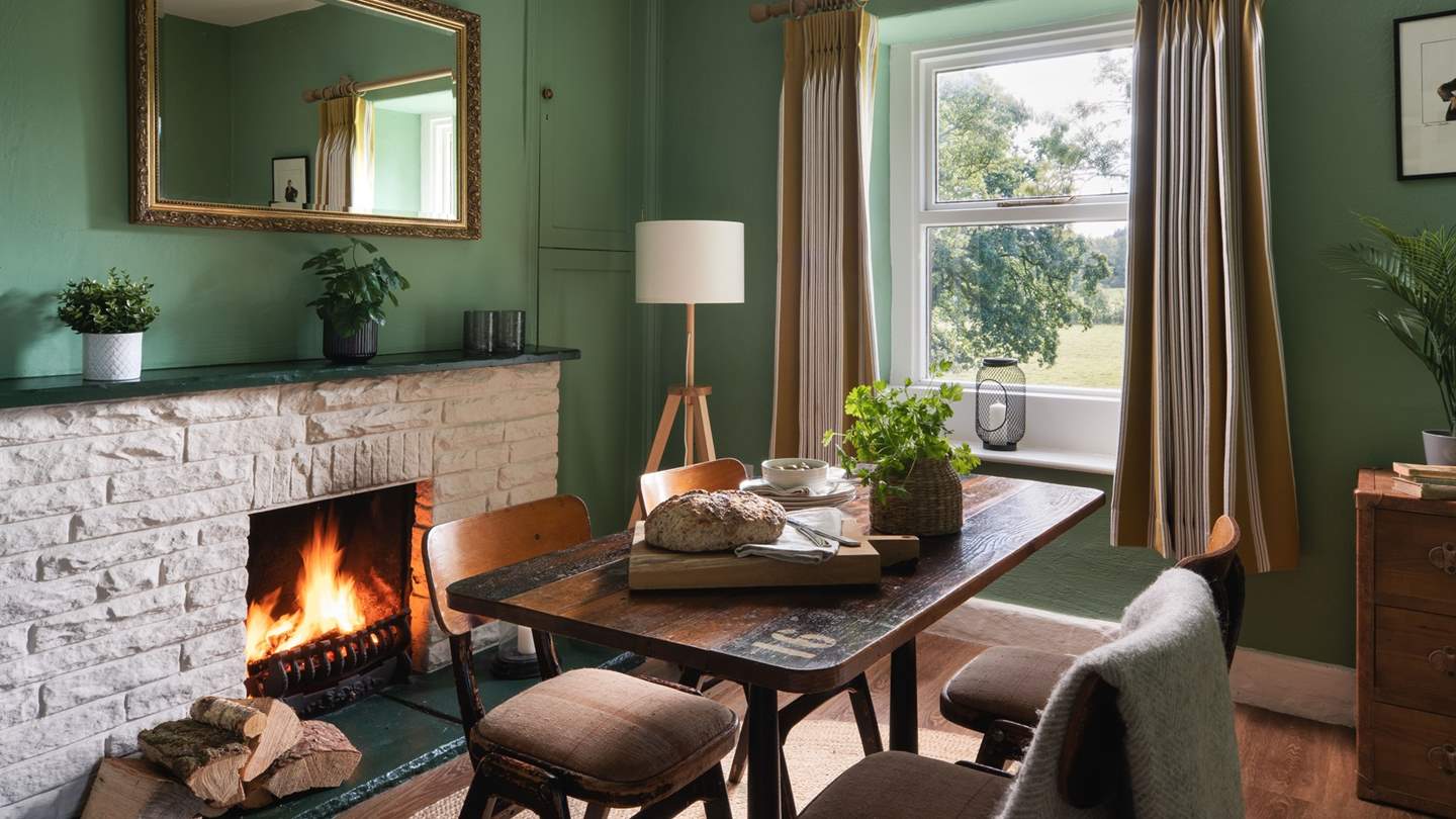 Enjoy pared-back brunches and lavish dinners in the inviting forest-green dining room 