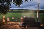 While away blissful moments in the wood-fired hot tub, taking in the magnificent countryside views 