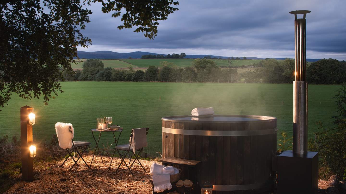 While away blissful moments in the wood-fired hot tub, taking in the magnificent countryside views 