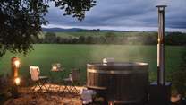 While away blissful moments in the wood-fired hot tub, taking in the magnificent countryside views 