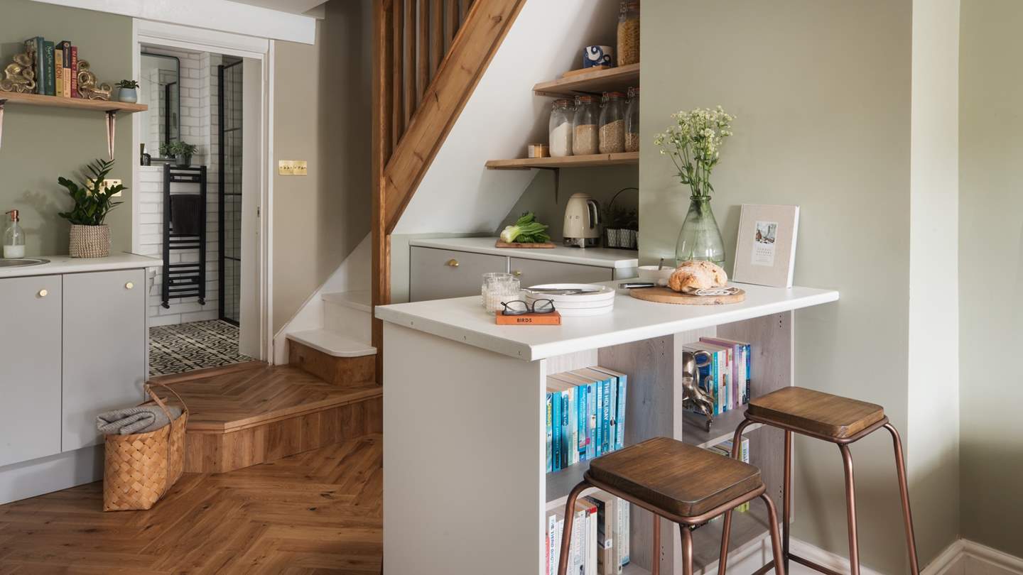 The breakfast bar with four stools is perfect for casual dining 
