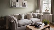 Settle on the plush grey sofa and stretch out in style... 