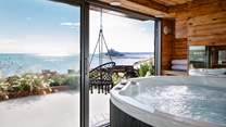 With panoramic scenery in every direction, the stunning hot tub hut is the dreamiest spot to unwind...