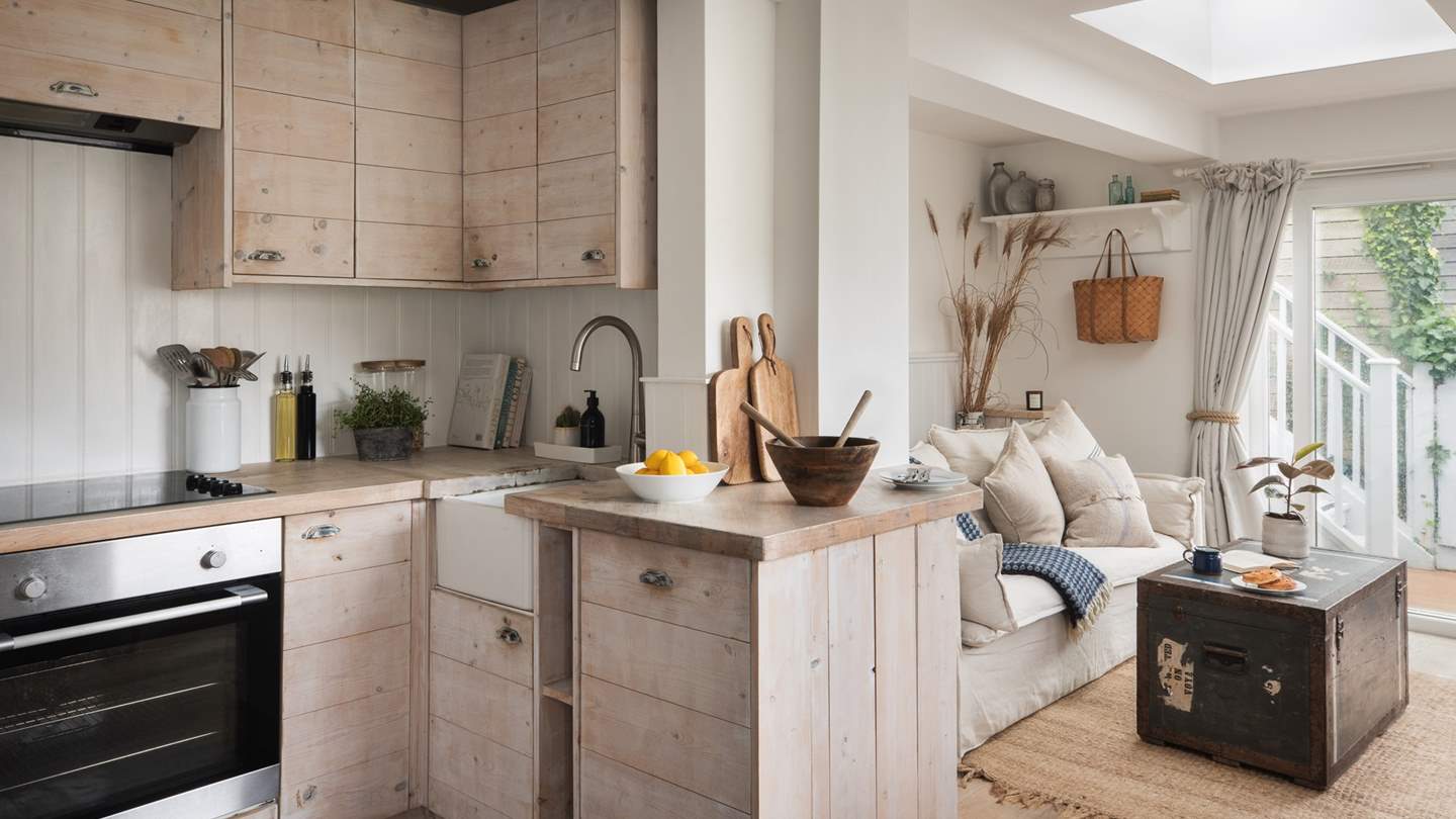 The chic kitchen is crafted with stunning natural wood, creating a relaxed environment for creating culinary delights