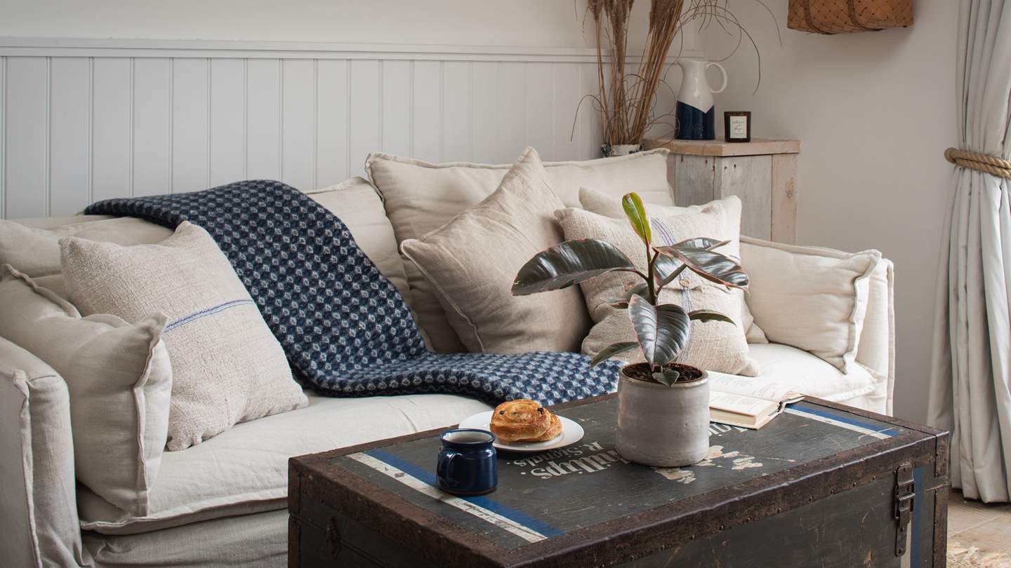 Settle on the stone-hued linen sofa with your chosen staycation novel... 