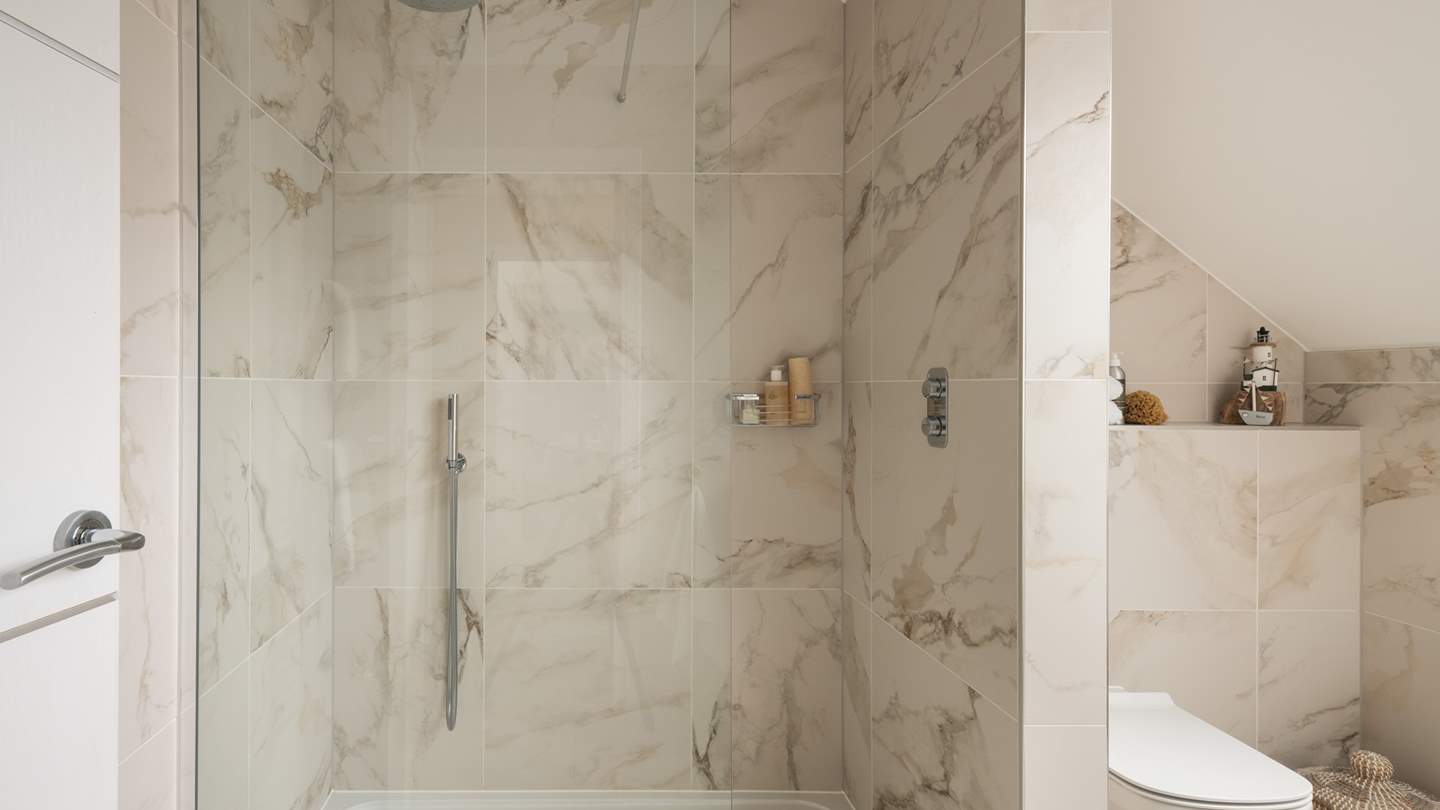 The ensuite bathroom features a large walk-in shower for wake me up ablutions 