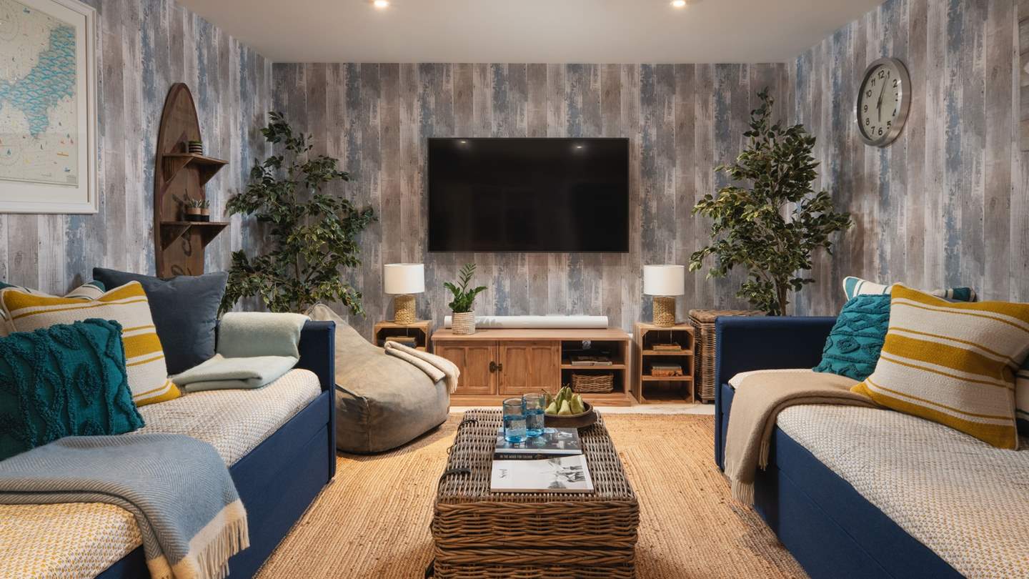 The cosy cinema room is perfect for gathering together in the evenings 