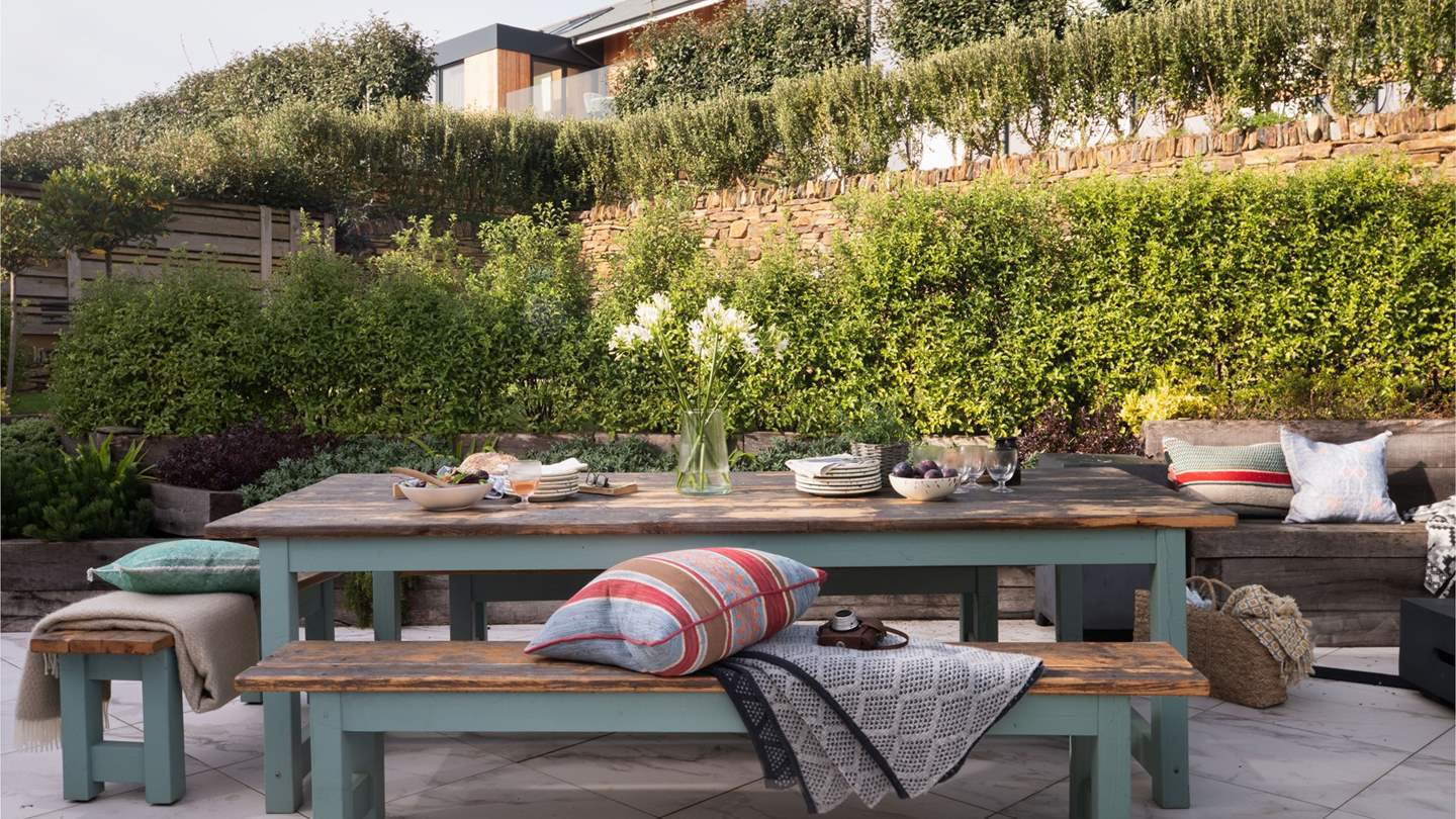 While away blissful moments alfresco in the charming garden...