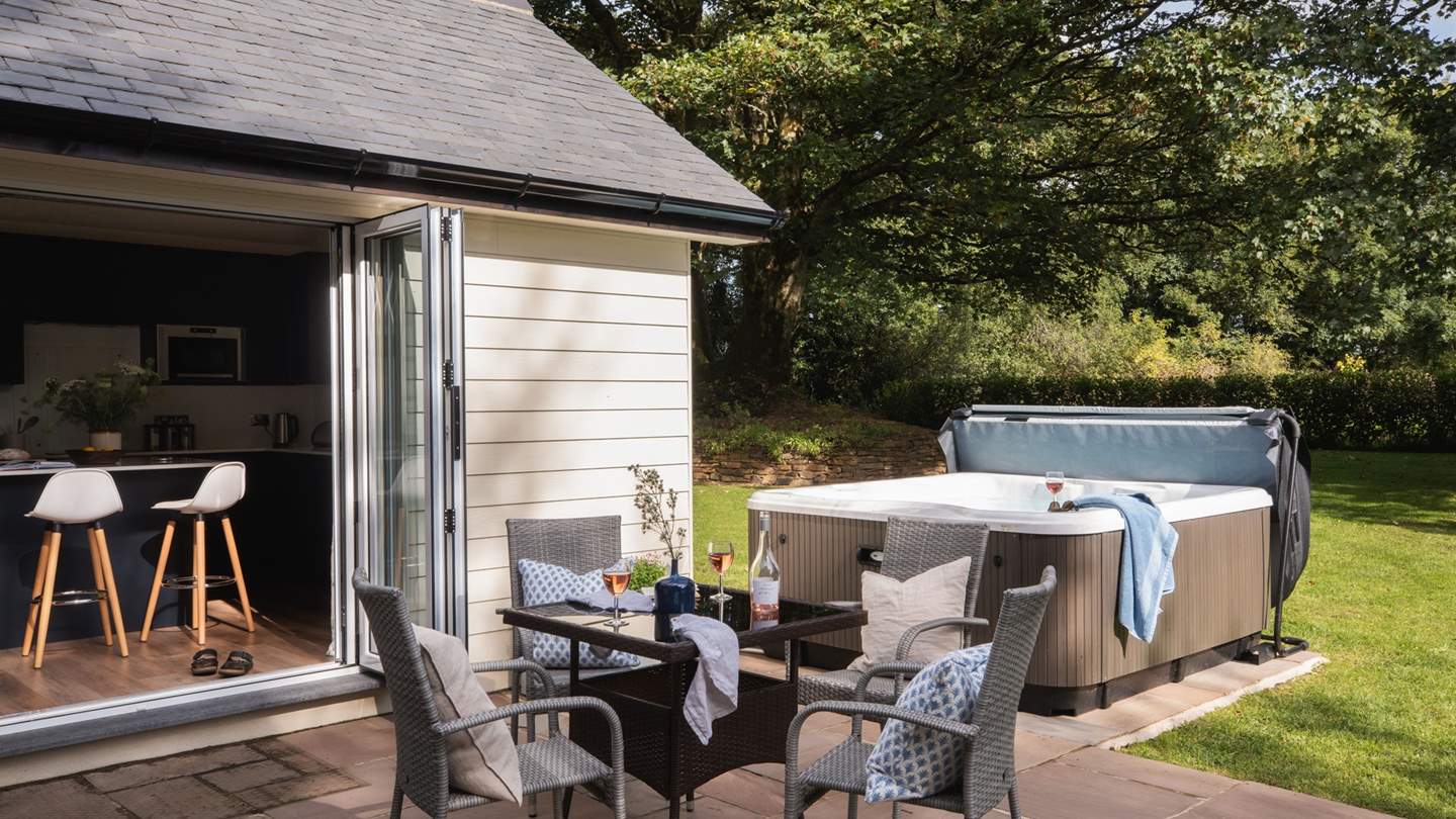 The bubbling hot tub promises a truly relaxing staycation 