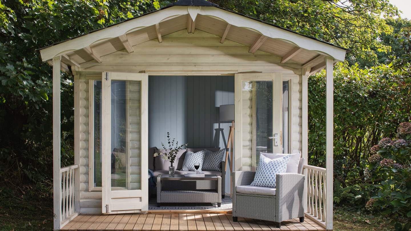 With a cosy sofa and coffee table, this is a lovely space to curl up with a glass in hand