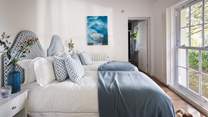 In soft blue hues, the second bedroom is a wonderful space for the little ones