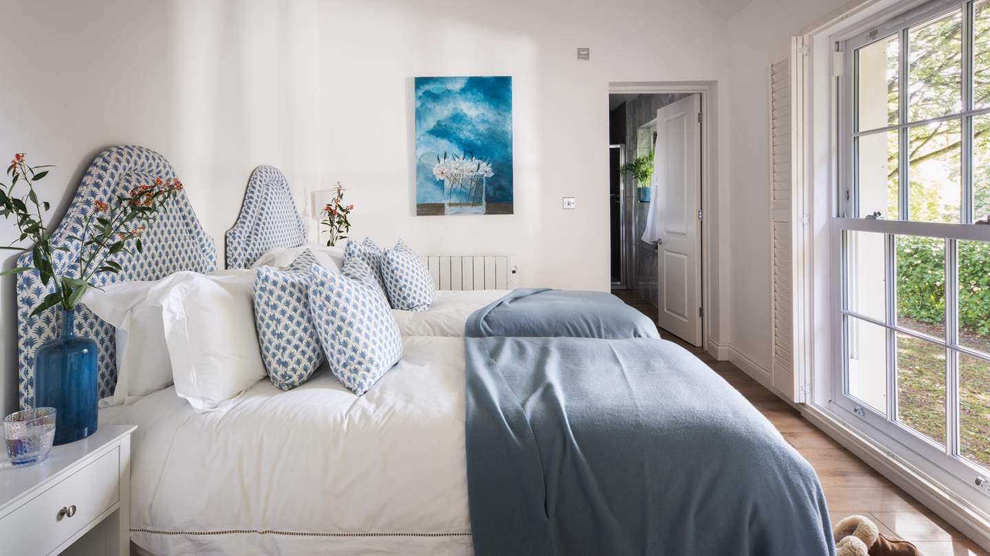 In soft blue hues, the second bedroom is a wonderful space for the little ones