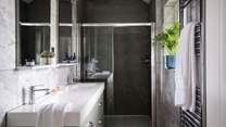 The stylish en suite has a rainfall shower for refreshing wake up moments 