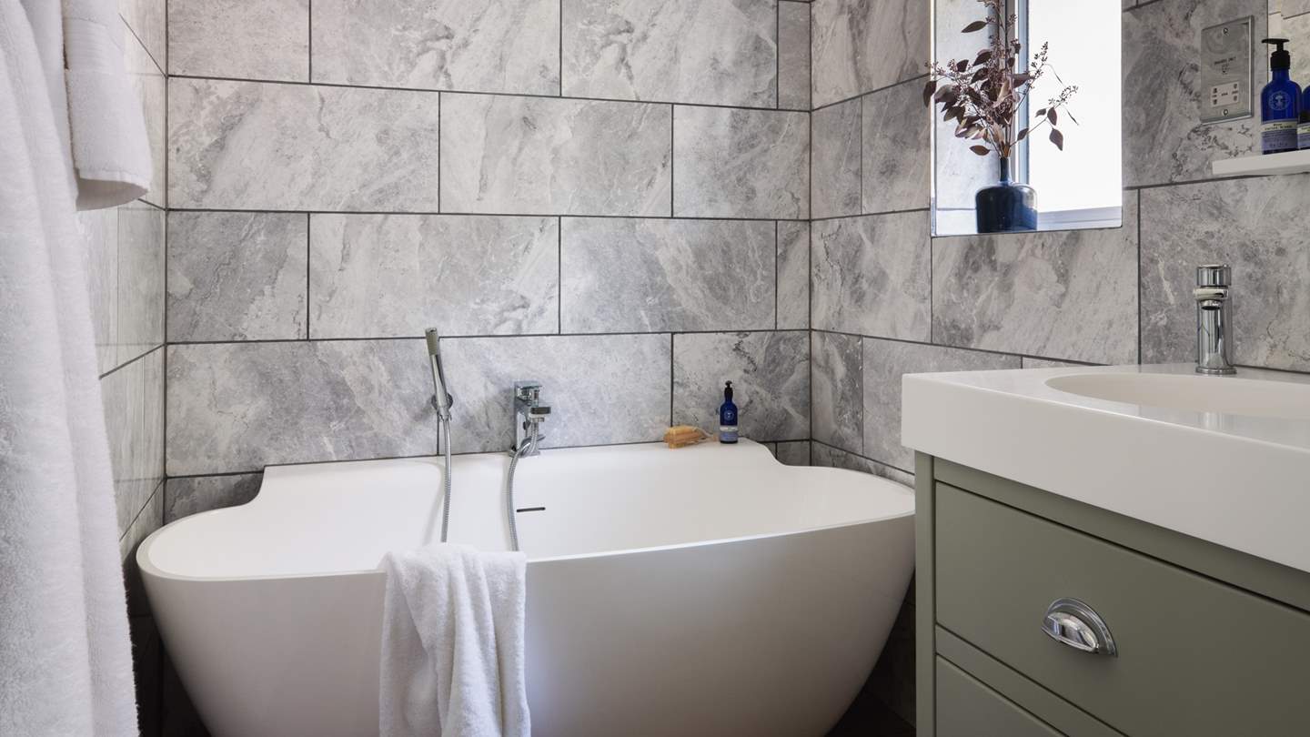 Lavish soaks in the darling slipper bathtub await you...