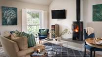 The flickering wood burning stove is made for gathering around with loved ones 